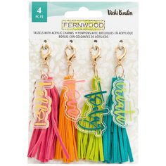 three different colored tassels with the word ferwood on them in front of a