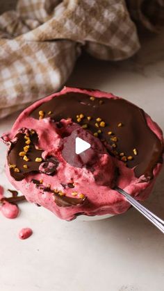 a scoop of ice cream with chocolate and sprinkles