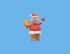 a santa clause figurine holding a cookie on top of a brick block wall