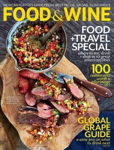 the cover of food and wine magazine, with a wooden cutting board filled with meat