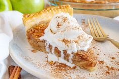 a slice of apple pie with whipped cream on top