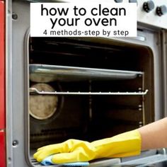 a person cleaning an oven with yellow gloves on their hands and the words how to clean your oven 4 method - step by step