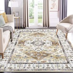 a living room area with couches, chairs and rugs