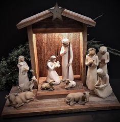 a nativity scene with figurines and lights