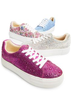 Put a little sparkle in your step with the SIDNY all-over rhinestone platform sneakers. These sparkly sneakers can be paired with your best dress or favorite jeans, offering a combination of glamour and stylish comfort. The SIDNY rhinestone shoe is available in a variety of captivating colors and prints to make any look a little more luxurious! Manmade upper materials with rhinestones Lace-up closure Textile lining with cushioned insole Textured rubber outsole 1.5" inch platform 45.27” inch tota Backless Sneakers, Sparkly Sneakers, Bride Sneakers, Studded Sneakers, Pink Platforms, Best Dress, Rhinestone Shoes, Pink Sneakers, Betsey Johnson Jewelry