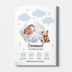 a baby's birth announcement card with a photo and a teddy bear