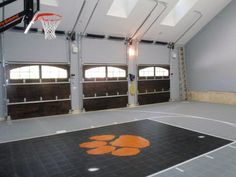 an indoor basketball court with the logo of the clemson tigers painted on it's floor