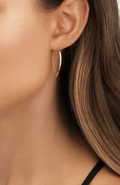 Designed to be gracefully threaded through your lobes, these gleaming 14-karat-gold hoops top your look with modern, minimalist elegance. 1 1/4" drop, 1/8" width Thread-through style 14k gold Imported Lana Jewelry, Gold Hoops, Modern Minimalist, Hoop Earrings, Thread, Yellow Gold, Nordstrom, Luxury Fashion, Yellow