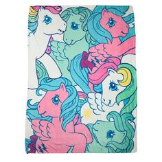 a pink and blue blanket with many different colored unicorns on it's sides