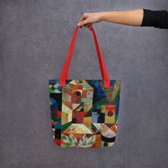 "A spacious and trendy tote bag to help you carry around everything that matters. This essential everyday tote featuring \"Burggarten (Castle Garden)\" by Paul Klee is a must have! * 100% spun polyester fabric * Bag size: 15″ × 15″ (38.1 × 38.1 cm) * Capacity: 2.6 US gal (10 l) * Maximum weight limit: 44lbs (20 kg) * Dual handles made from 100% natural cotton bull denim * Handle length 11.8″ (30 cm), width 1″ (2.5 cm) * The handles can slightly differ depending on the fulfillment location * Blan Artistic Rectangular Canvas Shopping Bag, Everyday Tote Bag With Artwork, Everyday Artwork Tote Bag, Artsy Rectangular Canvas Travel Bag, Rectangular Bags With Artwork For Daily Use, Artistic Large Capacity Rectangular Canvas Bag, Artsy Everyday Bags With Artwork, Artistic Square Bags For Everyday, Canvas Tote Bag With Artwork For Everyday Use