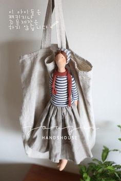 a doll hanging from a hook on a wall