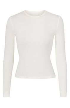 Specially washed for a vintage appearance, this long-sleeve top from Kim Kardashian's SKIMS hugs your figure and goes with endless casual looks. 17" length (size Medium) High crewneck Long sleeves 92% cotton, 8% spandex Machine wash, line dry Imported High Stretch White Crop Top For Fall, White Fitted Long Sleeve Top For Fall, Fitted Long Sleeve Cotton Crop Top, Fitted Cotton Long Sleeve Crop Top, Fitted Cotton Top With Thumbholes, Fitted Cotton Tops With Thumbholes, Basic Long Sleeve Crop Top, White Long Sleeve Top With Thumbholes For Spring, Fitted Cotton Long Sleeve Top For Winter