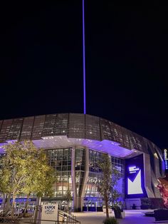 a large building that has a blue light on it