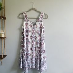 Never Worn Dress In Perfect Condition! Lattice Detail On Front Chest. White A-line Printed Sundress, Bohemian Sleeveless Patterned Dress For Spring, White Bohemian Sleeveless Dress With Floral Print, Flowy White Sleeveless Dress With Floral Print, Bohemian Sleeveless Mini Dress For Daytime, White Bohemian Printed Sleeveless Dress, White Printed A-line Sundress, White V-neck Sleeveless Printed Dress, White Printed V-neck Sleeveless Dress