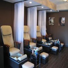 a salon with chairs and stools lined up against the wall