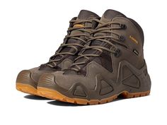 Lowa Zephyr GTX Mid - Men's Hiking Boots : Reed : The Lowa Zephyr GTX Mid boots are ideal for both hiking and hunting. These lightweight, multi-functional hiker boots have a rugged construction with a flexible fit for all-day comfort and support. Hiking boot made of split leather and fabric upper. GORE-TEX waterproof membrane keeps out the wet elements while allowing moisture to escape, creating a drier, more comfortable foot environment. Protective rubber rand around the toe and heel. Lace-up c Brown Tactical Boots For Outdoor Activities, Brown Tactical Hiking Boots With Round Toe, Gore-tex Work Boots With Rubber Sole, Brown Tactical Hiking Boots For Outdoor, Brown Tactical Hiking Boots For Outdoor Activities, Tactical Brown Hiking Boots For Outdoor Activities, Tactical Brown Work Boots For Outdoor Activities, Tactical Gore-tex Hiking Boots With Round Toe, Brown Tactical Hiking Boots