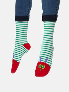 "One Sunday morning the warm sun came up and - pop! - out of the egg came a tiny and very hungry caterpillar." Product Details Unisex 75% cotton, 20% polyester, 5% spandex Size & Fit Small: Shoe Sizes: 5.5-9/Sock: 9-11 Large: Shoe Sizes: 8.5-12/Sock: 10-13 Each purchase helps to fund literacy programs and book donations to communities in need. Fun Cotton Winter Socks, Fun Winter Cotton Socks, Playful Green Socks For Stocking Stuffers, Red Cotton Socks For Spring, Playful Red Cotton Socks, Cute Cotton Socks For Playtime, Cotton Socks For Winter Playtime, Novelty Cotton Socks For Winter, Novelty Cotton Winter Socks