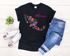 If you're looking for a gift to show you love and support Mexico and its culture, handcrafts then this Mexico Map Floral Otomi Mexican Emboidery Bird Design will be perfect for you. Mexican design, mexican embroidery, ropa con mapa de Mexico, mapa floral, flores bordadas otomis, diseno mexicano. You've now found the staple t-shirt of your wardrobe. It's made of a thicker, heavier cotton, but it's still soft and comfy. And the double stitching on the neckline and sleeves add more durability to wh Embroidery Bird, Mexico Map, Mexican Shirts, Mexican Embroidery, Mexican Outfit, Mexican Designs, Mexican Art, Bird Design, Design T Shirt