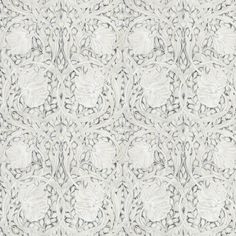 an intricately designed wallpaper pattern in white and grey