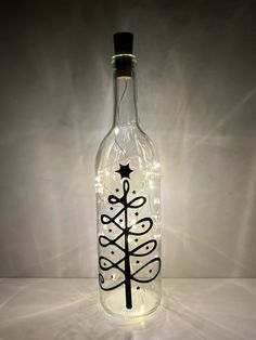 a bottle with a christmas tree on it