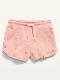 a pink shorts with fruit print on the side and drawstring at the bottom