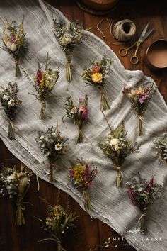 A selection of mini dried flower bouquets on a table with a pair of scissors, cup of coffee, and twine. Flowers Australia, Round Bouquet, Everlasting Flowers, Dried Bouquet, Wildflower Bouquet, Flower Care, Wildflower Wedding, Dried Floral, Dried Flower Bouquet