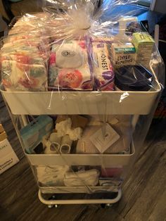 a cart filled with lots of items on top of a wooden floor