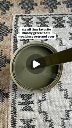 an open can of green paint on top of a rug with the caption, my all time favorite mouldy green that works over carpet