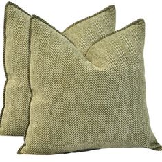 two green pillows sitting next to each other