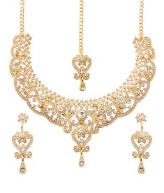 PRICES MAY VARY. NEW! Touchstone Indian Bollywood Choice Rich Traditional Exclusive Floral Workmanship Sparkling Rhinestone Grand Bridal Designer Jewelry Necklace Set In Gold Tone For Women. Extra Long Earrings: Length: 2.30 Inches. Specifications: Necklace Circumference 15 Inches. Extendable/Adjustable With Extra Links/Chain Up To 20 Inches. Earring Weight (Single) 7 Gms. Earring Length 2.30 Inches. Earring Width 0.75 Inch. Mangtika Length 6.50 Inches. OCCASION Will add luster when worn for a w Gold Jewelry Sets With Stone Work For Eid, Bollywood Style Gold Jeweled Jewelry Sets, Traditional Gold Crystal Jewelry Sets, Festive Gold Crystal Jewelry Sets, Gold Crystal Jewelry Sets With Stone Work, Gold Kundan Necklace With Crystal Stone Work, Bridal Maang Tikka, Indian Jewelry Set, Extra Long Earrings