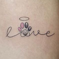 the word love is written in cursive writing with two paw prints on it