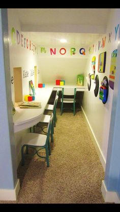 a room with several tables and chairs on carpeted flooring next to a wall