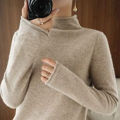 Winter Cashmere Top, Cashmere Tops For Winter, Winter Long Sleeve Cashmere Tops, Beige Stretch Sweater For Winter, Snug Beige Winter Sweater, Cozy Beige Tops For Winter, Warm Beige Long Sleeve Top, Cozy Beige Winter Tops, Beige Winter Tops