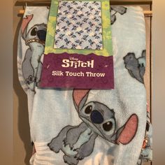 a blanket with the stitch logo on it