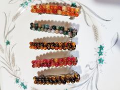 These are nice, simple but pretty barrettes, can be worn for any occasion. They are made of natural stone, something nice to wear in the hair. They are 80mm long about 3 inches and 12mm wide, a little over 1/4 inch. The stones are 6mm, with five different types to choose from. Top is Orange Carnelian, Indian Moss Agate, Center Is Orange Jasper, Red Watermelon Jade, and bottom is Tiger Eye. Pretty Barrettes, Beaded Barrettes, Red Watermelon, Orange Carnelian, Something Nice, Christmas Deals, Aquamarine Blue, Moss Agate, Barrettes