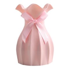 a pink vase with a bow on it