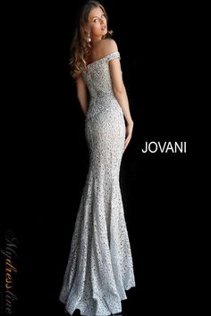 Looking for a truly unique and eye-catching evening dress? Jovani 61357 is perfect for making a statement at your next formal event. This fitted gown features an off-the-shoulder bodice with a straight, folded neckline and straight back. The floor-length skirt is fitted with a lightly fla end and sweeping train. A zipper closure ensures a perfect fit. Lace Long Gown, Beaded Wedding Gowns, Exquisite Gowns, Unique Prom Dresses, Beaded Wedding, Stunning Gowns, Lace Evening Dresses, Mermaid Skirt, Lace Fashion