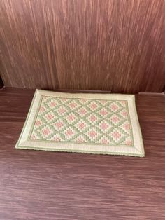 a door mat on the side of a wooden door