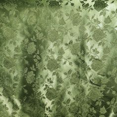 an image of a curtain with leaves and flowers on it's side in the sunlight