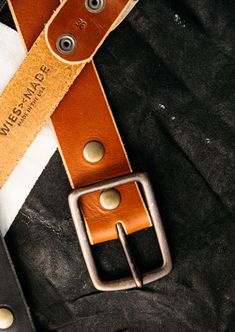 Simple, durable and works with everything. Hand made in our California shop of high quality 8oz American latigo leather, with a solid brass buckle. True to size, will soften and patina with wear. 1.7" thick leather strap. Adjustable Rustic Leather Belt, Classic Hand-tooled Leather Belt, Rustic Vintage Brown Leather Belt, Brown Suade Belts, Adjustable Hand-tooled Brown Belt, American Leather, American Spirit, Brass Buckle, Leather Pieces