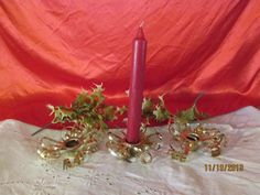 a candle and some decorations on a table