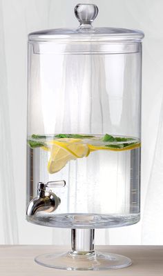 a glass container filled with water and lemon slices