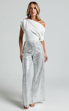 Get ready to shine bright all night in our Looma Sequin High Waisted Wide Leg Pants in Silver! These stunning straight leg pants are perfect for any festival or party night, adding a touch of glamour to your look. Made from high-quality polyester sequins, these pants will have you feeling like the life of the party. With their flattering high waist and full length style, they are designed to make you feel confident and empowered. So get ready to turn heads and dance the night away in our Looma S Metallic Wide Leg Pants Outfit, Silver Wide Leg Pants Outfit, Party Outfit With Pants, Silver Pants Outfit Night, Silver Sequin Pants Outfits, Silver Party Outfit, Beyoncé Birthday, Silver Pants Outfit, Super Wide Leg Pants