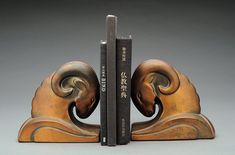 two bookends made out of wood and metal