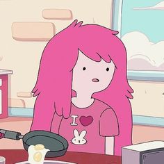 a woman with pink hair sitting in front of a frying pan on top of a table