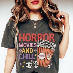 "🍂 Unleash your inner scream queen or king with our \"Horror Movies and Chill\" graphic tee! 🎃📽️ Whether you're a vampire of vintage scares or a werewolf of wicked humor, this Comfort Colors Retro Halloween Shirt is your must-have Fall fashion statement, designed to be rocked all year long. It's a spook-tacular gift for horror movie aficionados, bringing thrills, chills, and a whole lot of laughter. Slide into this tee, grab some popcorn (extra butter, of course), and get ready to kick back w Horror Movies And Chill, Fall Graphic Tee, Shirt Knot, Movie Lover Gift, Horror Movie Shirts, Fall Graphic, Sky Design, Movie Lover, Retro Halloween