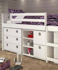 a white bunk bed sitting next to a purple and white dresser under a zebra print wallpaper