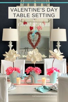 valentine's day table setting with pink and white flowers in vases on the dining room table