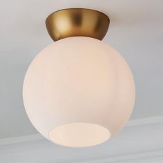 a close up of a light fixture in a room with white walls and flooring