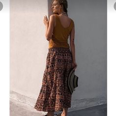 Size Large Nwt Free People All About Tiers Skirt. Pockets Elastic Waist Flat 17”, Length 34”. Very Flattering Fit And Waistband Has A Lot Of Stretch Due To Elastic. Casual Long Skirt With Boho Print, Casual Boho Print Long Skirt, Casual Boho Print Maxi Skirt, Casual Boho Print Skirt, Bohemian Brown Bottoms For Day Out, Brown Midi Skirt For Summer, Brown Relaxed Fit Maxi Skirt For Summer, Brown Midi Skirt For Day Out, Summer Brown Tiered Skirt Bottoms